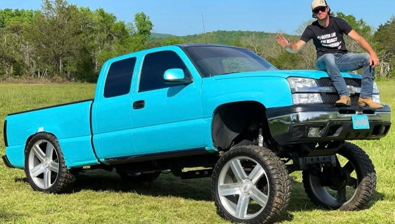 Whistlin Diesel squatted truck.webp